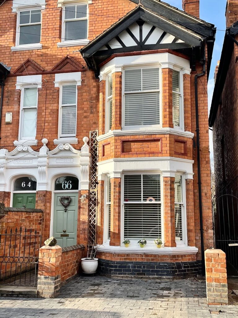 a fireplace in front of a brick building