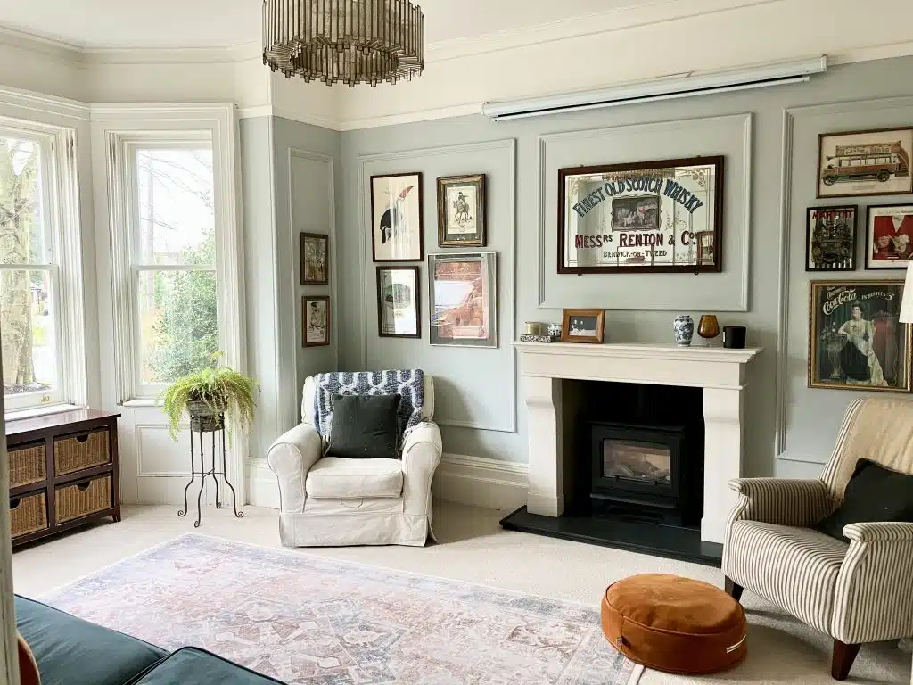 a living room filled with furniture and a fire place