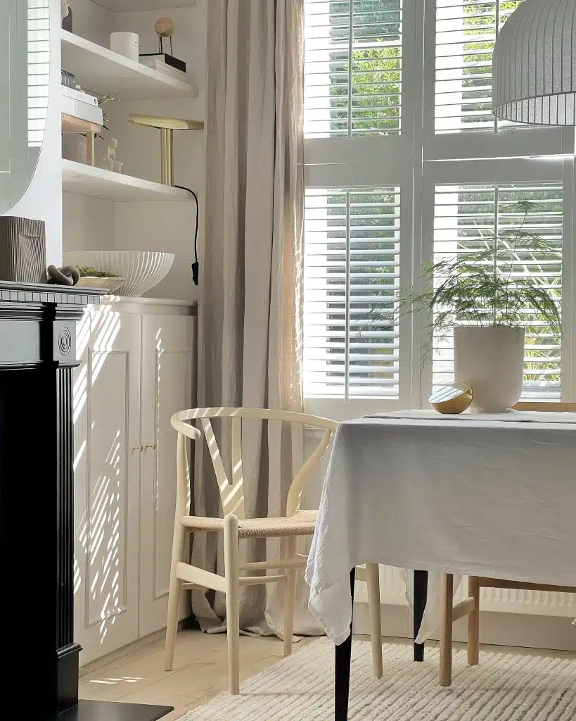 a dining room table in front of a window