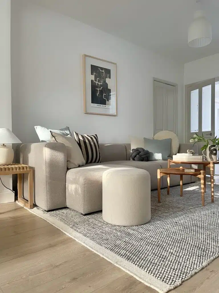 a living room filled with furniture and a large window