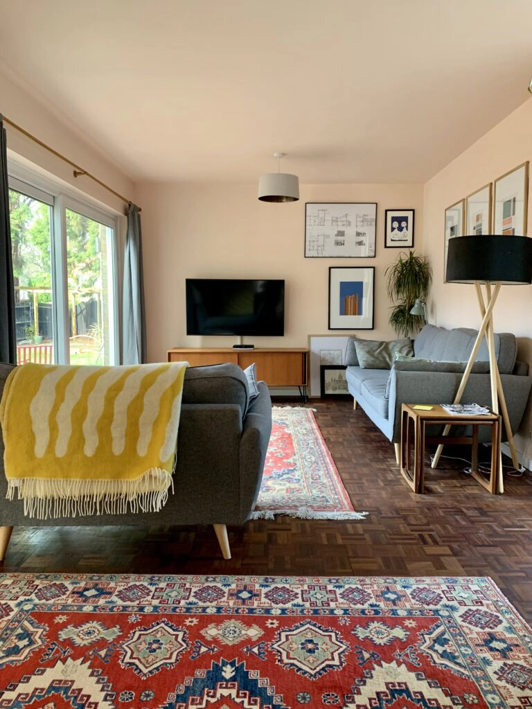 a living room filled with furniture and a rug