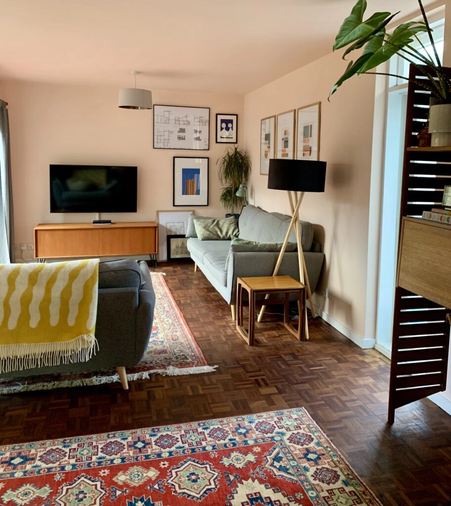 a living room filled with furniture and a flat screen tv