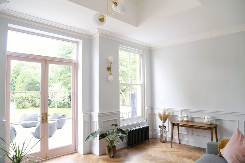 a view of a living room filled with furniture and a large window