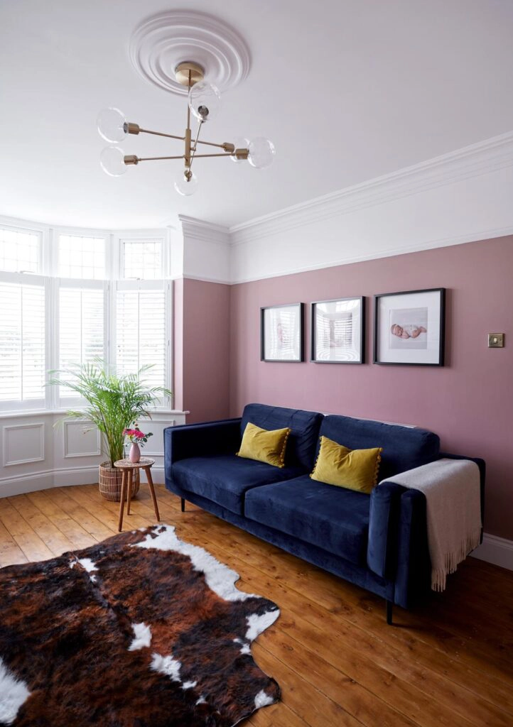 a view of a living room filled with furniture and a fireplace