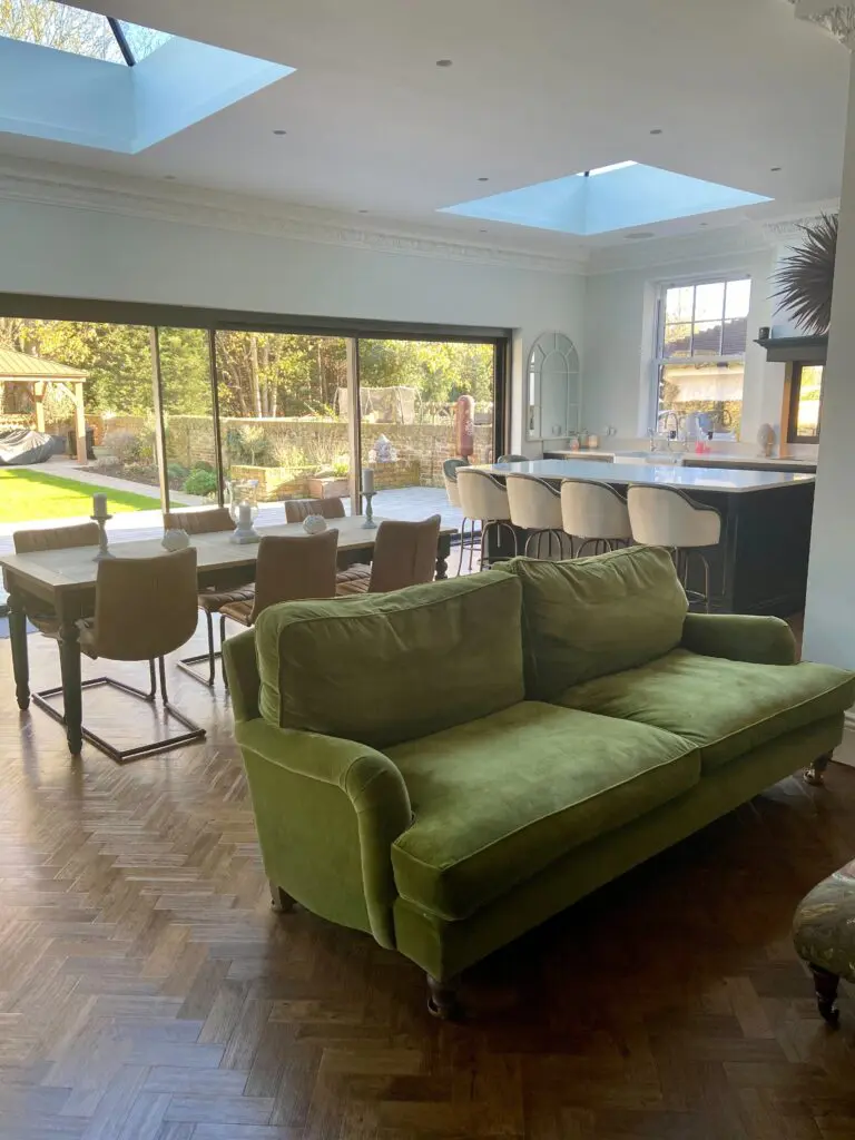 a living room filled with furniture and a large window