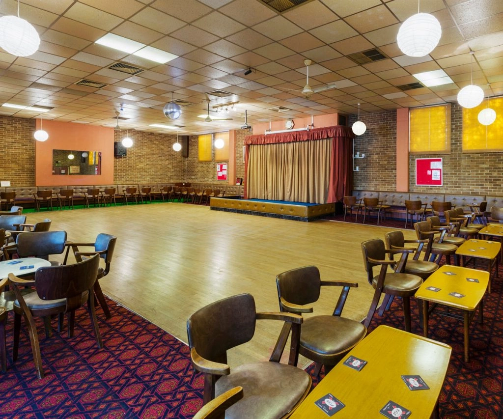 a room with tables and chairs