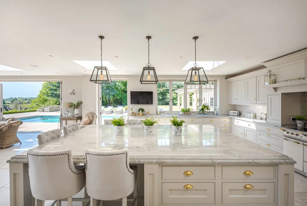 a kitchen with a sink and a mirror