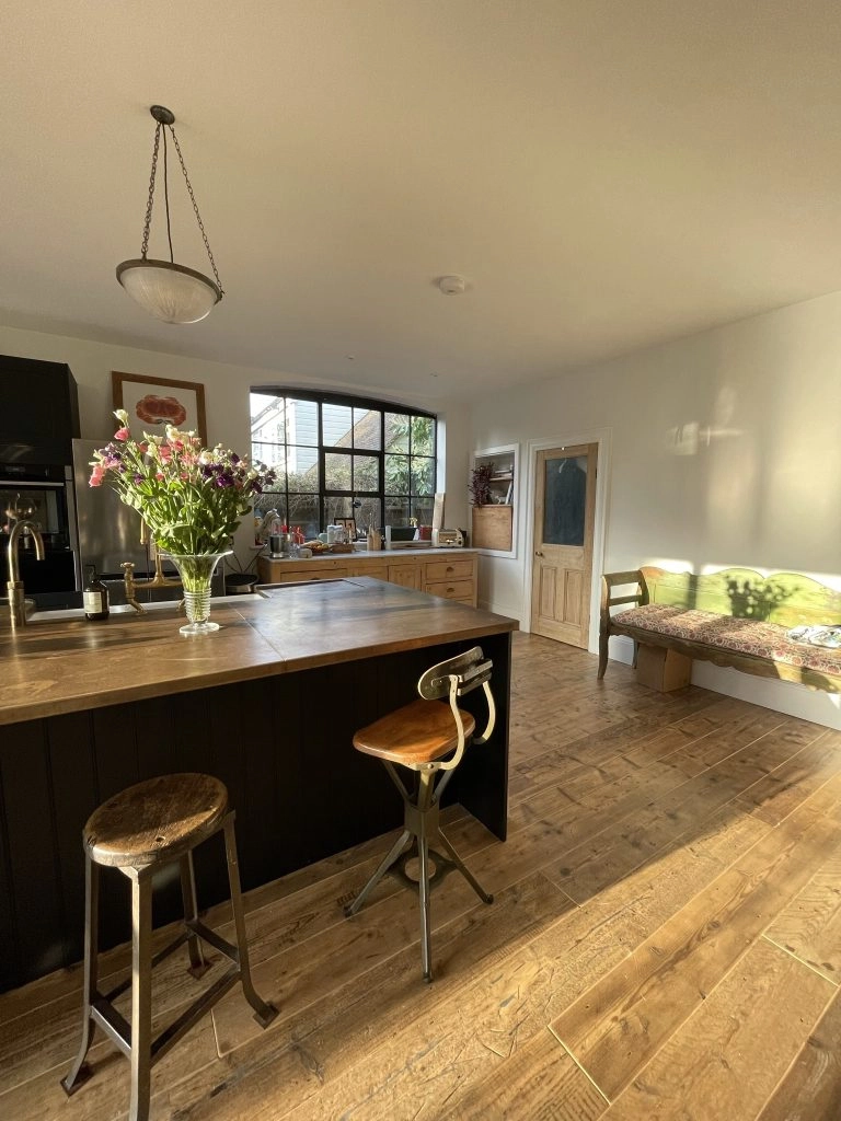 a living room filled with furniture and a large window