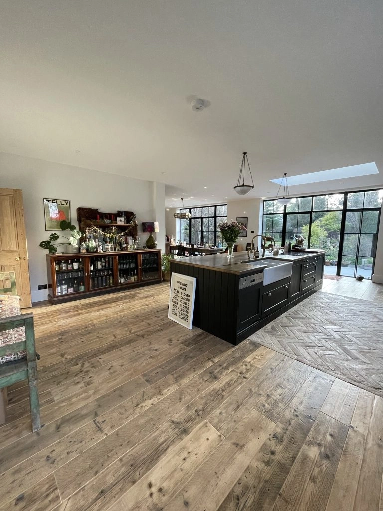 a room filled with furniture next to a building