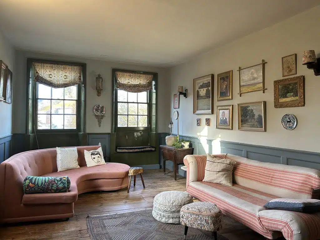 a living room filled with furniture and a large window