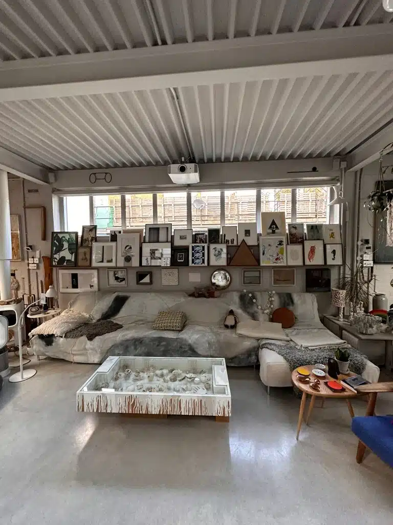 a living room filled with furniture and a large window