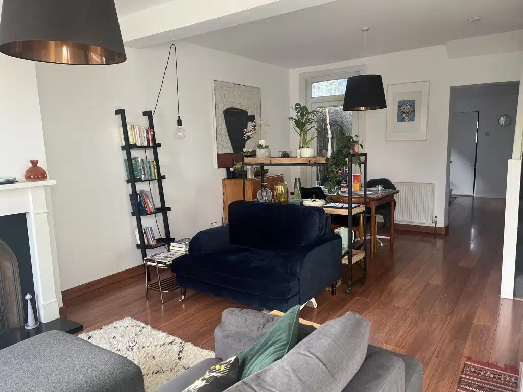 a living room filled with furniture and a tv