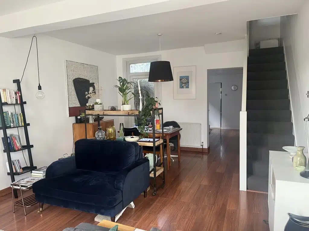 a living room filled with furniture and a fireplace