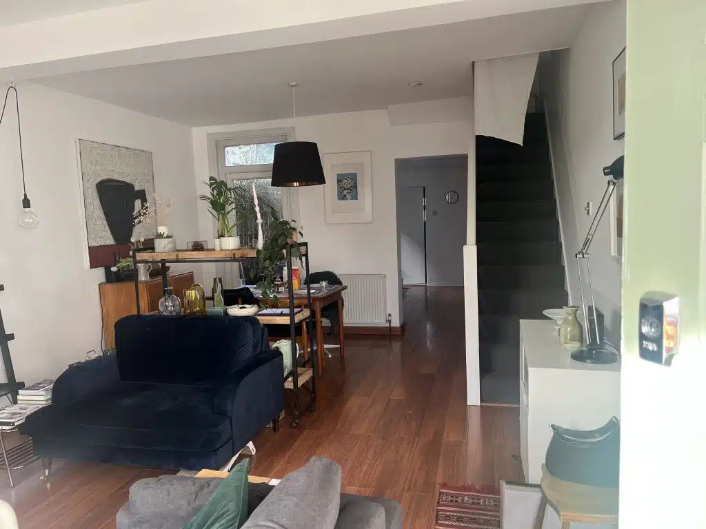 a living room filled with furniture and a flat screen tv