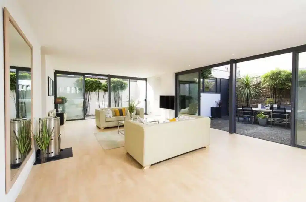 a room filled with furniture and a large window