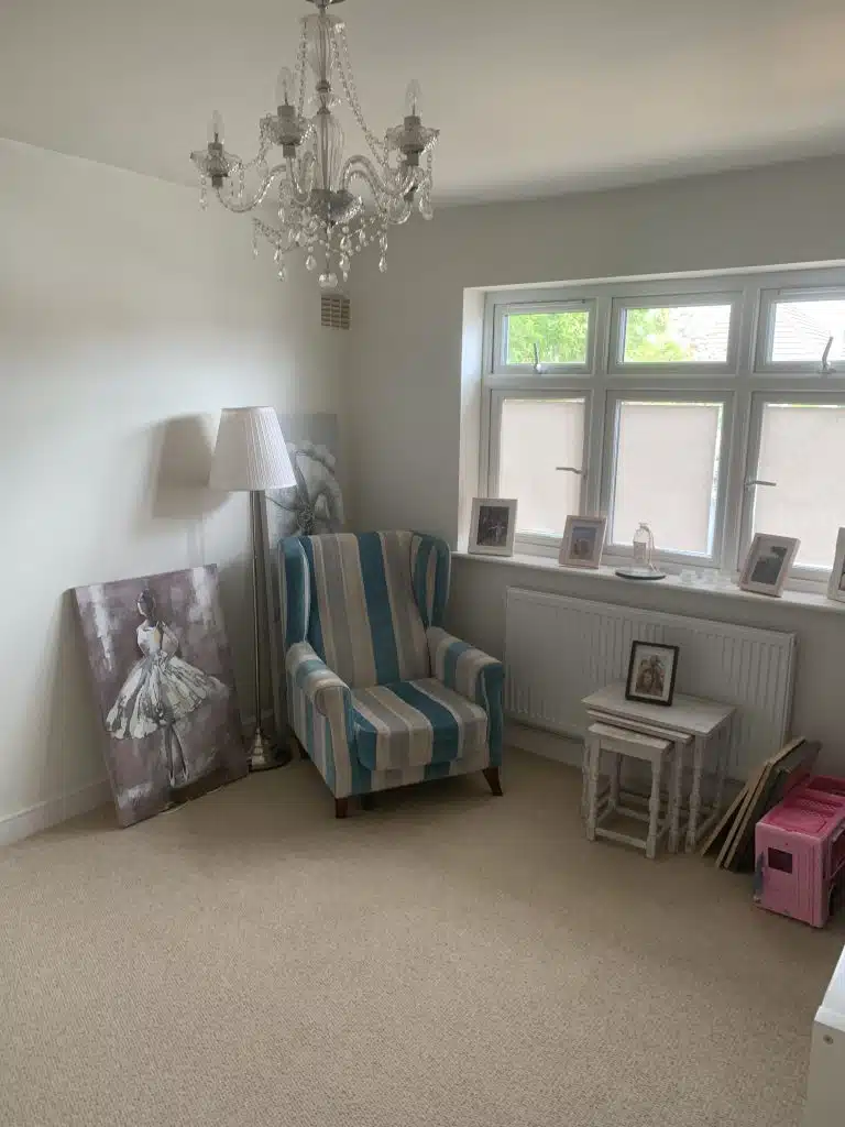 a bedroom with a large window