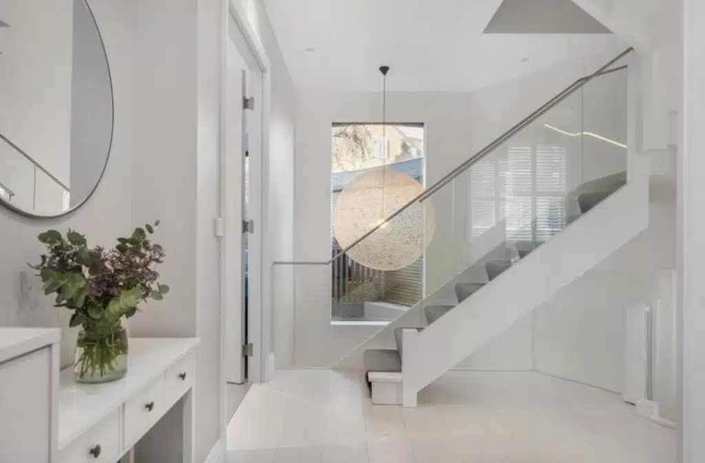 a room with a sink and a mirror