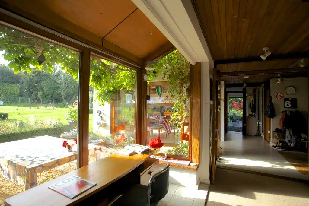 a room filled with furniture and a large window