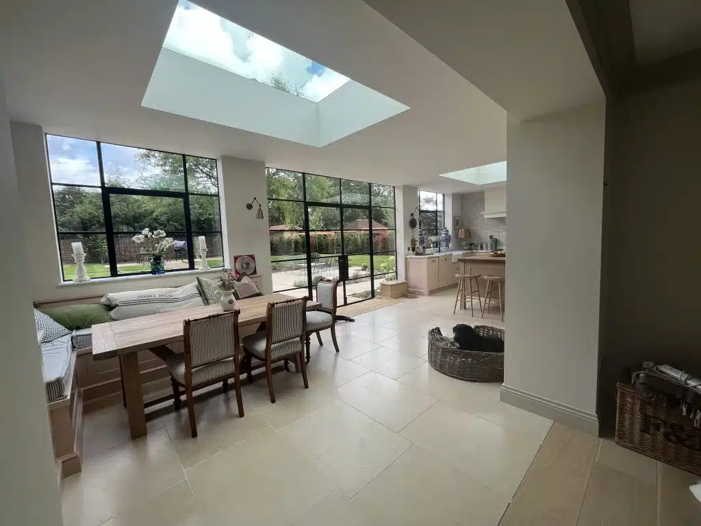 a room filled with furniture and a large window