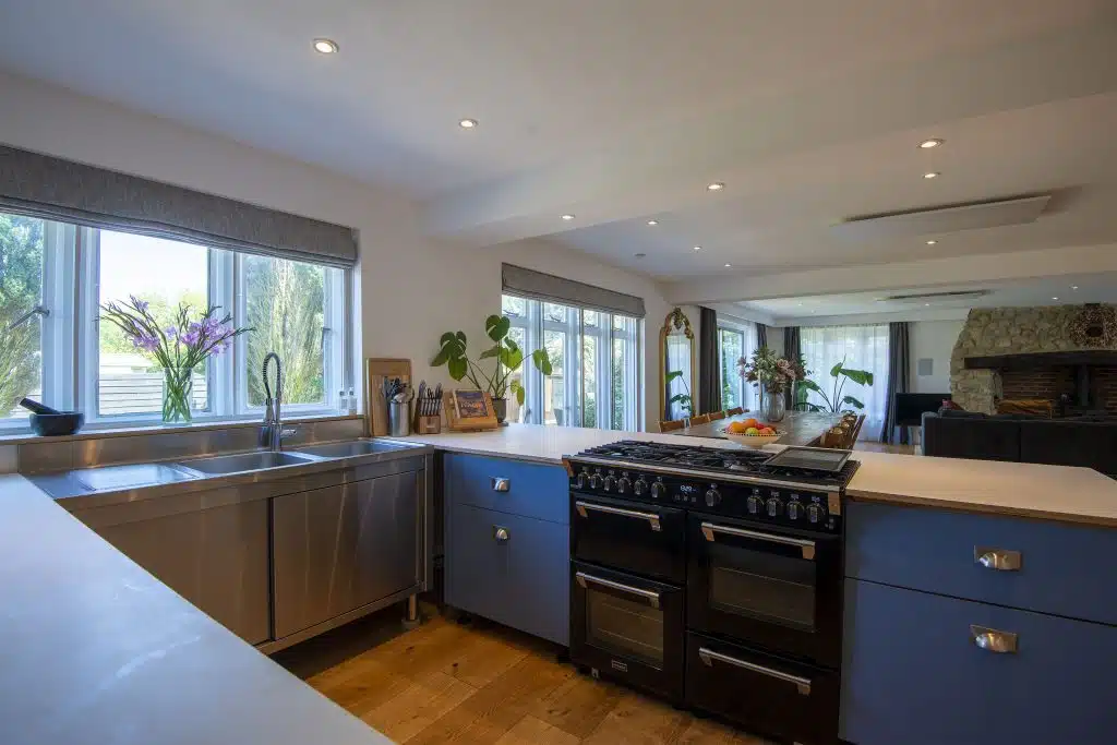 a kitchen with an island in the middle of a room