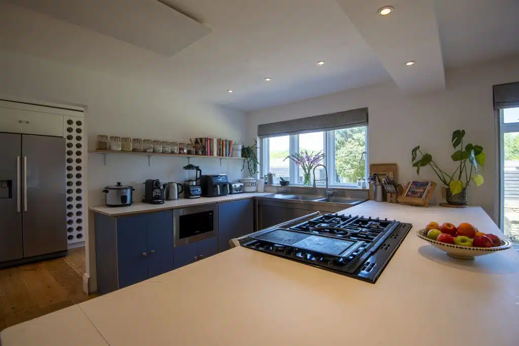 a kitchen with an island in the middle of a room