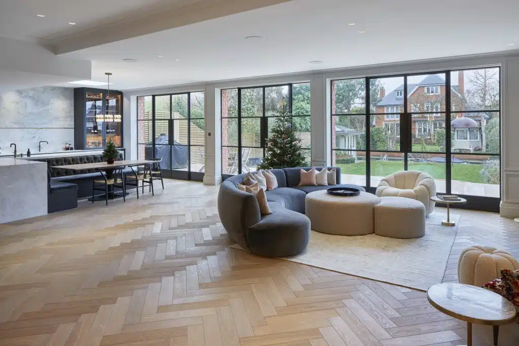 a living room filled with furniture and a large window