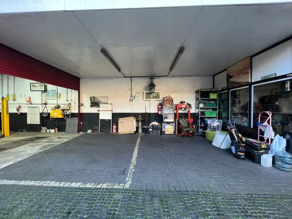 a group of people standing in a parking lot